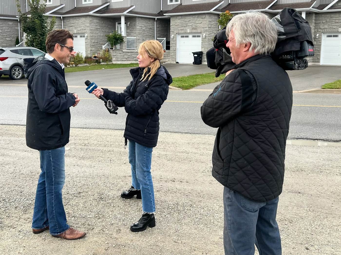 Leslie Farkas answering questions from CityNews in Wasaga Beach